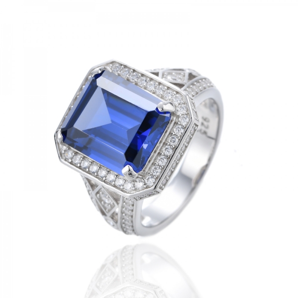 Bague en argent rhodié avec tanzanite taille émeraude et zircone cubique blanche ronde 