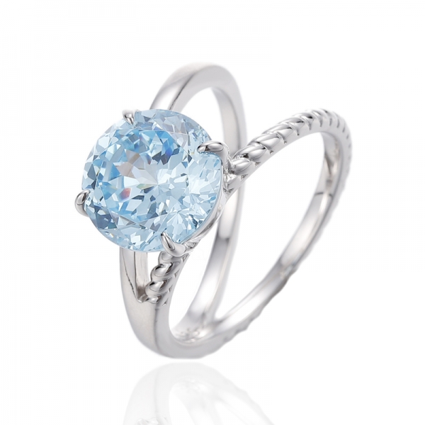 Bague en argent rhodié avec zircon cubique bleu et diamant rond 