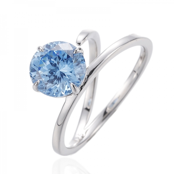 Bague en argent rhodié avec zircon cubique bleu et diamant rond 