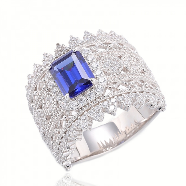 Bague en argent rhodié avec tanzanite taille émeraude et zircon cubique blanc rond 