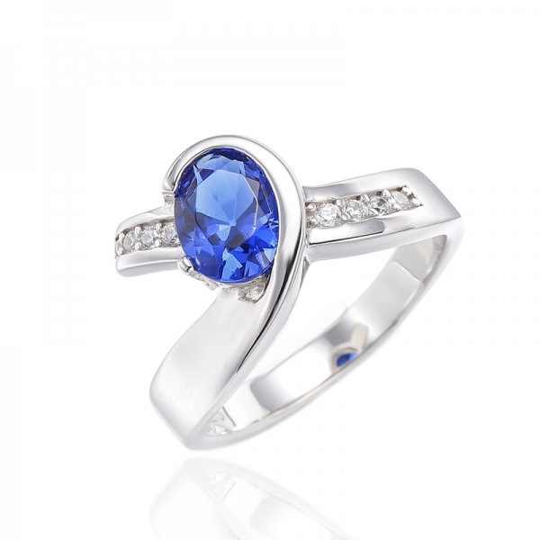 Bague en argent plaqué rhodium avec zircon cubique bleu de forme ovale et ronde blanche 