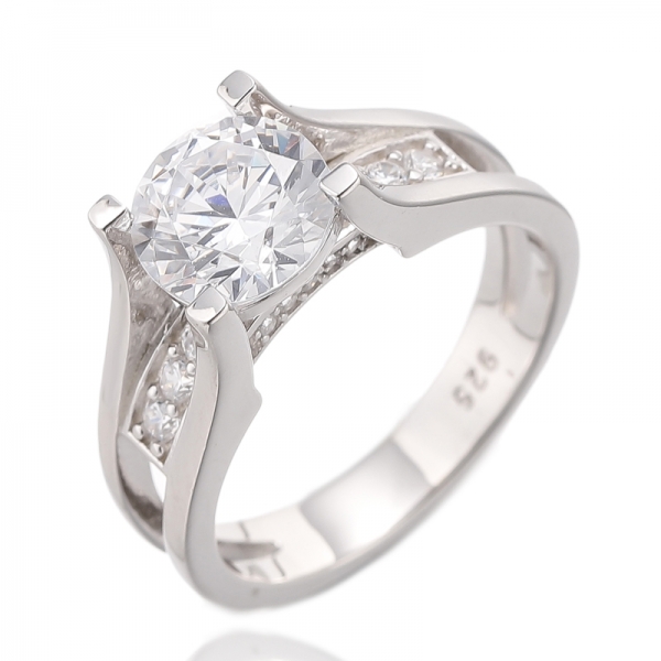 Bague en argent rhodié avec corindon bleu rond et zircon cubique blanc 